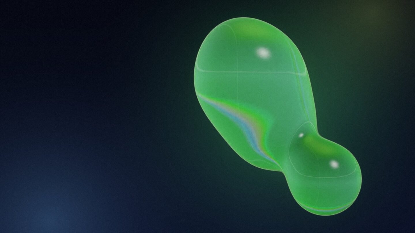Green liquid-glass drop shape on a dark background, illustrating lead magnets that attract buyers
